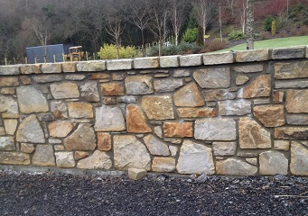 Random sandstone sizes on garden wall
