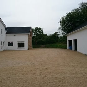 Gravel driveway around house using Leitrim sandstone